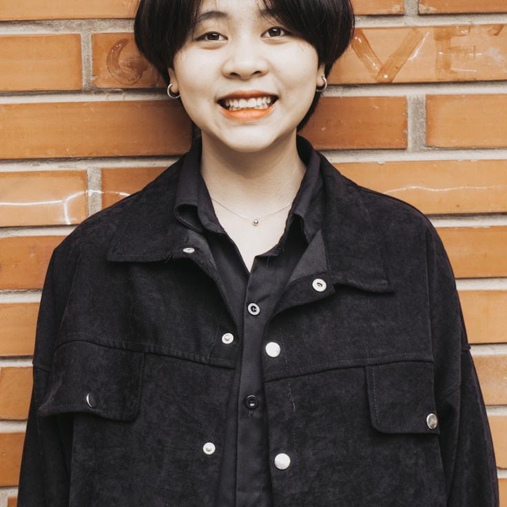 Alex Morgan, Lead Design Strategist at Quiet Morning Messages, reviewing corporate floral arrangements